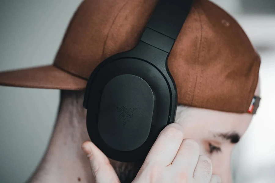 man in brown hat with black headphones