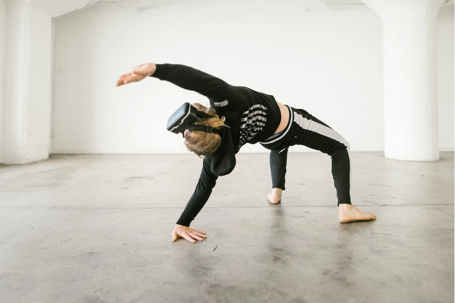 person dancing while wearing virtual headset