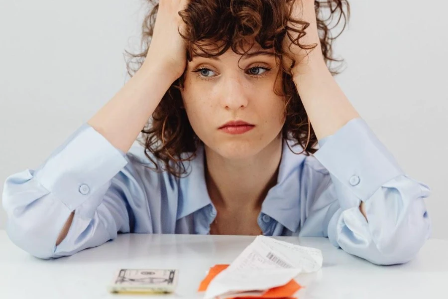 Woman low on cash looking frustrated