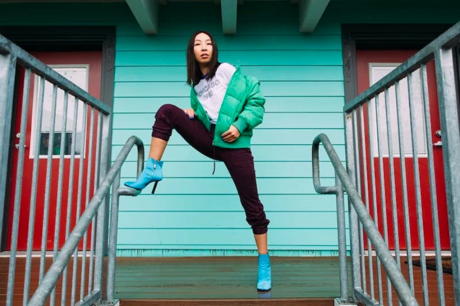 Woman standing on a porch wearing high heels