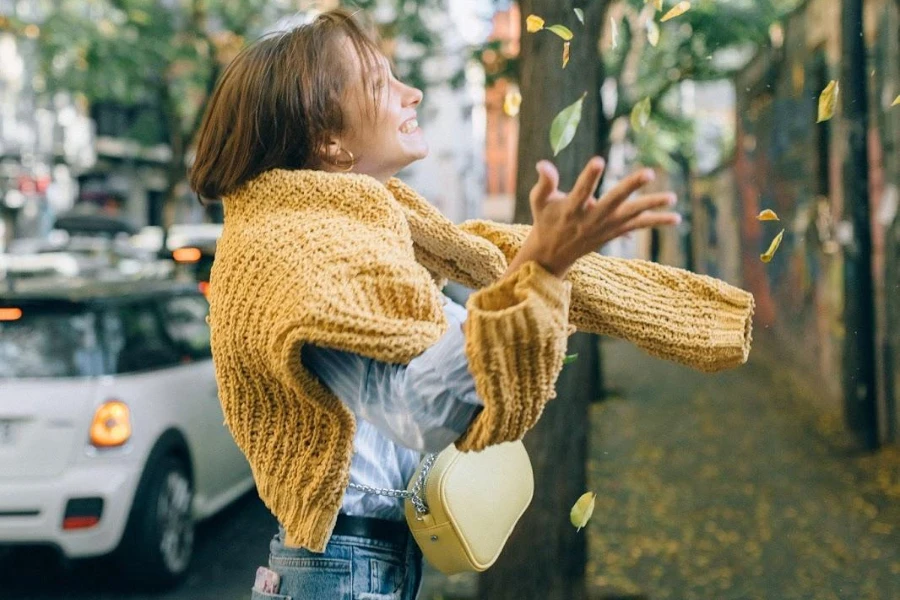 Woman with a sweater tied around her shoulders
